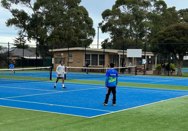 Junior squad on court with their coach.