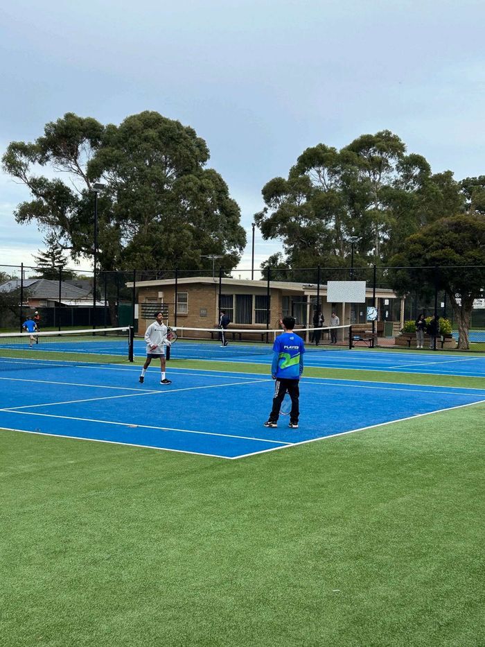 Junior squad training on court with their coach