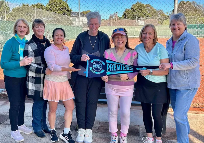 Burden Park ladies team group photo with a premiers pennant.