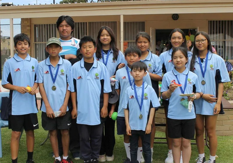 A larger junior group with medals after a WDTA competition.