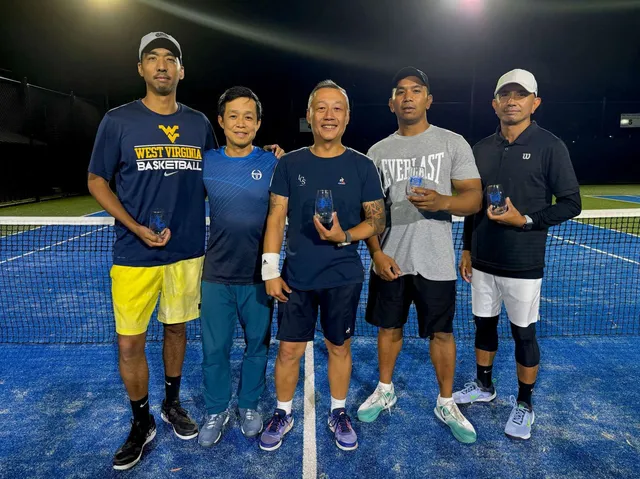 An adult night-tennis team under the floodlights