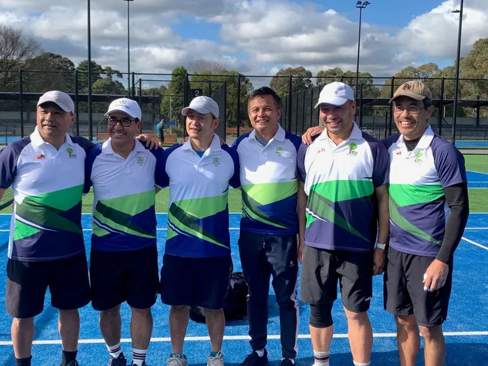 Six men in club match kit before a pennant fixture