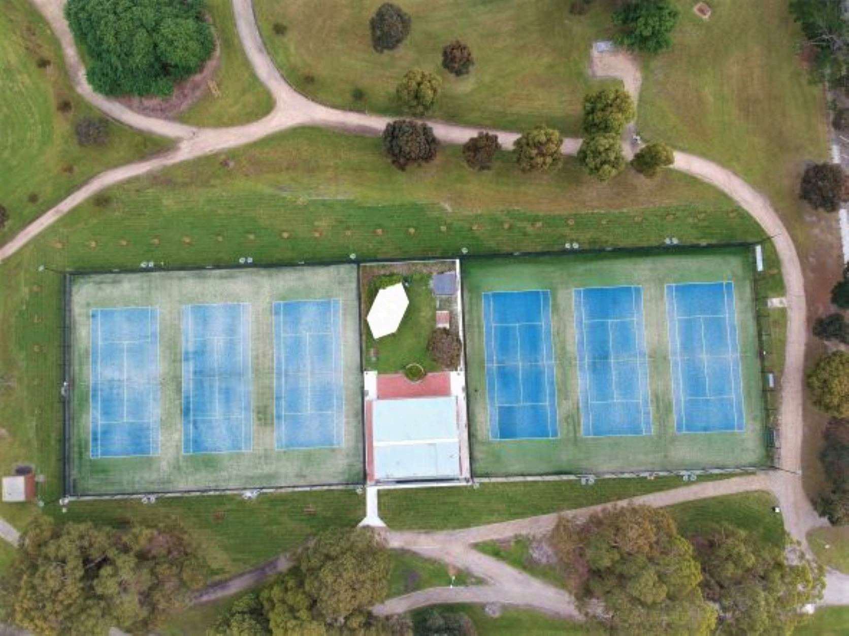 Drone view of Burden Park's six courts and clubhouse